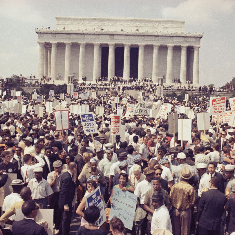 Large crowds gather at the Lincoln Memorial to demonstrate for civil rights in Washington, D.C. (1963)